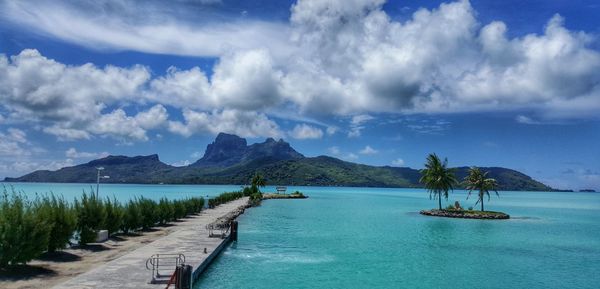 Scenic view of mountains against cloudy sky