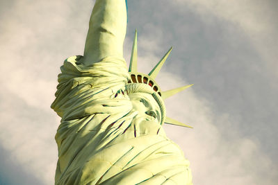 Low angle view of statue against cloudy sky