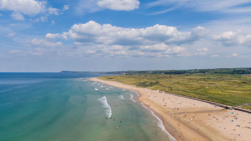 Scenic view of beach against sky