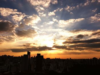 Silhouette of city at sunset