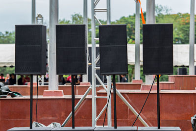 Close-up of empty chairs against building