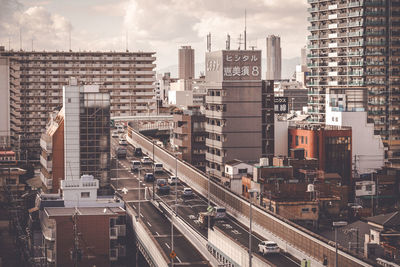 Aerial view of cityscape against sky