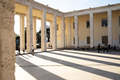 Buildings in city on sunny day