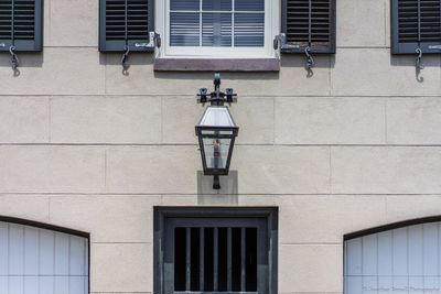 Electric lamp against residential building