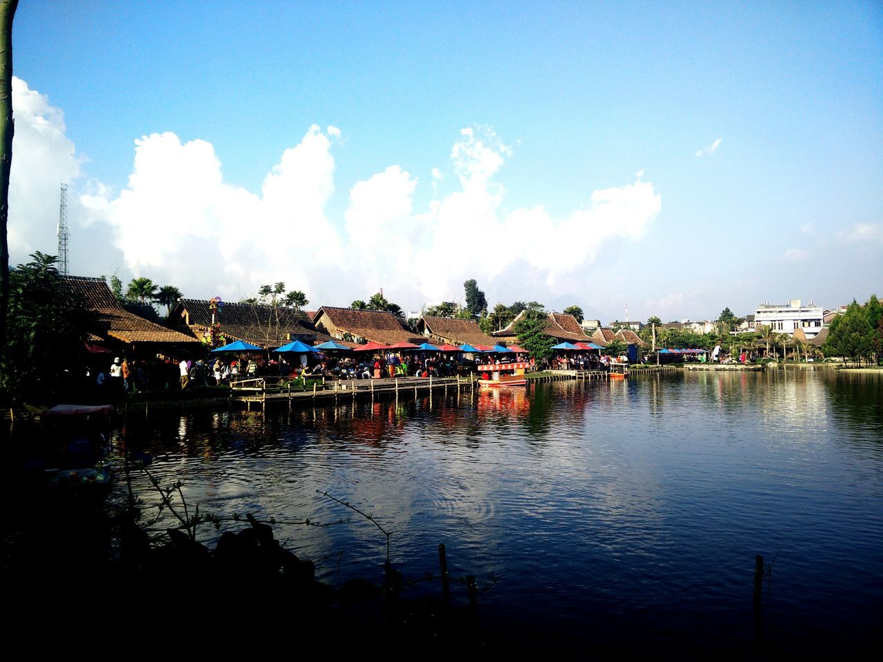 architecture, built structure, building exterior, sky, water, cloud - sky, reflection, house, cloud, blue, residential structure, waterfront, lake, residential building, river, day, outdoors, building, nature, tree