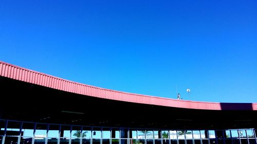 Low angle view of building against blue sky