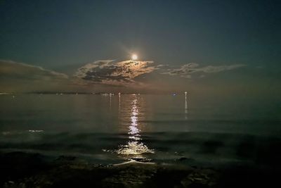 Scenic view of sea against sky at night