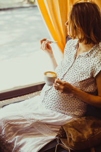 Woman drinking coffee cup