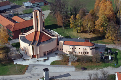 High angle view of buildings and trees in city