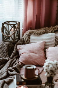 High angle view of cushions on bed