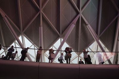 Group of people walking in shopping mall