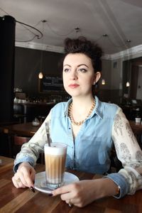 Woman sitting in restaurant