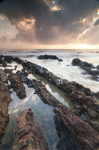 Scenic view of sea against cloudy sky