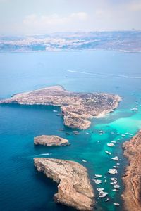 High angle view of sea shore against sky