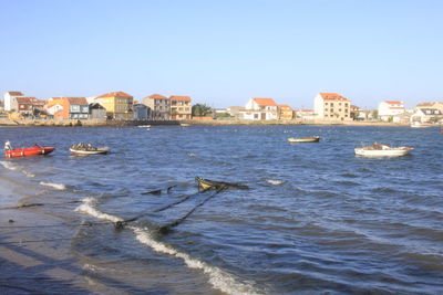 View of buildings against clear blue sky