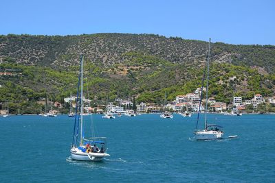 Sailboat on sea against sky