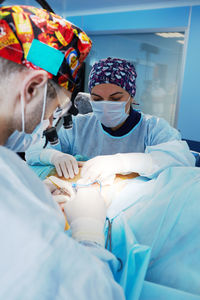 Female doctor examining patient in hospital