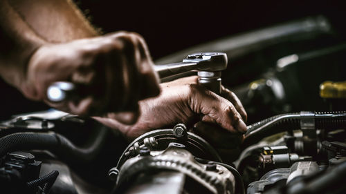 Close-up of man holding car