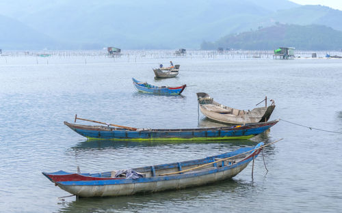 Boats moored in sea