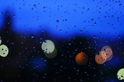 Close-up of bubbles against blue sky