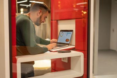 Businesswoman using laptop at home