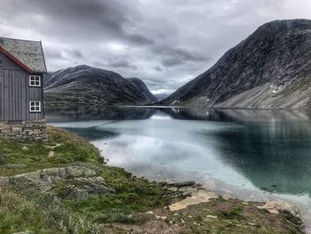 Scenic view of lake and mountains against sky