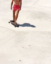 Low section of people walking on footpath