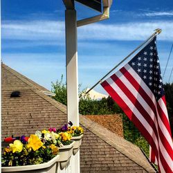 Close-up of flag against the sky
