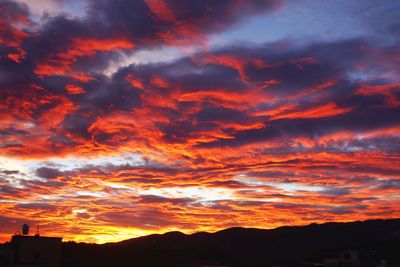 Low angle view of dramatic sky during sunset