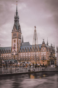 View of buildings against cloudy sky