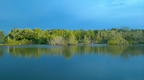 Scenic view of lake against blue sky