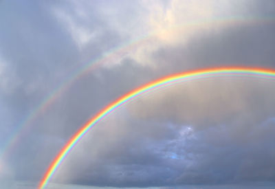 Low angle view of rainbow against sky