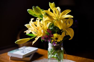 Close-up of flower vase against black background