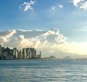 Panoramic view of sea and buildings against sky