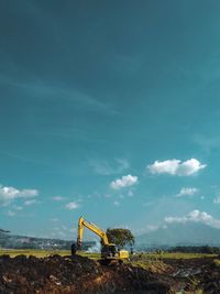 Construction site on field against sky