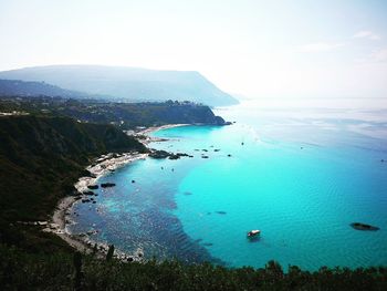 High angle view of bay against sky