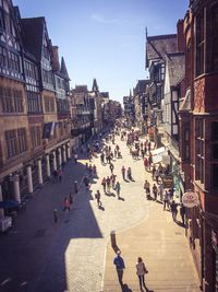 High angle view of people walking on road