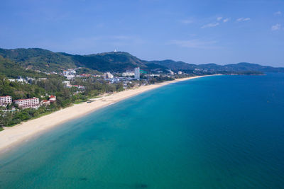 Scenic view of sea and mountains against sky