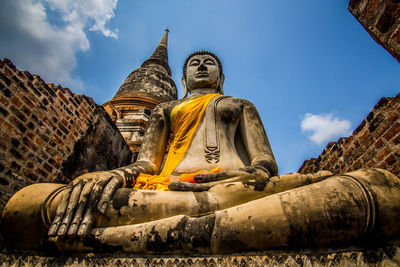 Low angle view of statue against sky