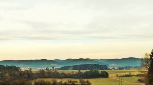 Scenic view of landscape against cloudy sky