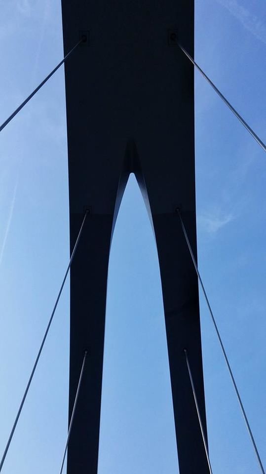 LOW ANGLE VIEW OF SUSPENSION BRIDGE AGAINST SKY