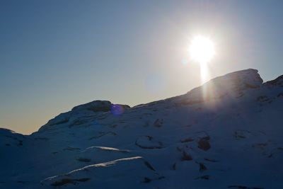 Scenic view of snowcapped mountain against sky