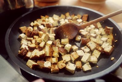 Close-up of tofu in frying pan