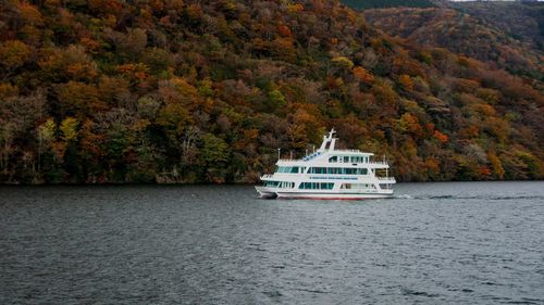 Scenic view of sea by building during autumn