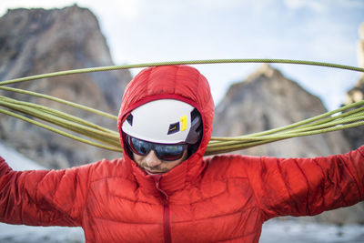 Climber coils rope after a successful climb