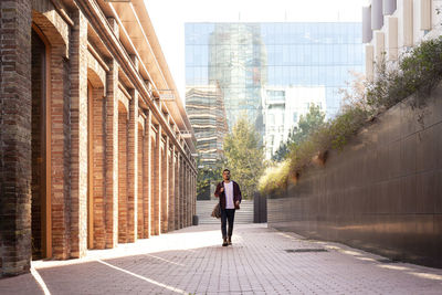 Rear view of woman walking in city