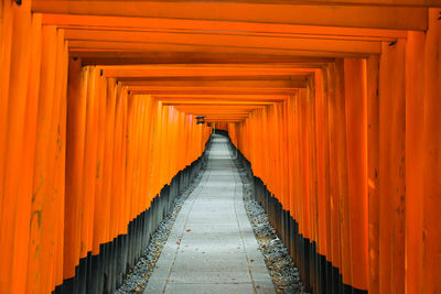 Vermillion gates at the fushimi inari shrine, kyoto, japan