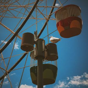 Low angle view of lamp post against blue sky