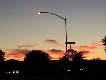 Low angle view of street light against sky at night