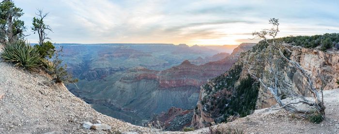 Panoramic shot of rocky mountains at grand canyon during sunrise